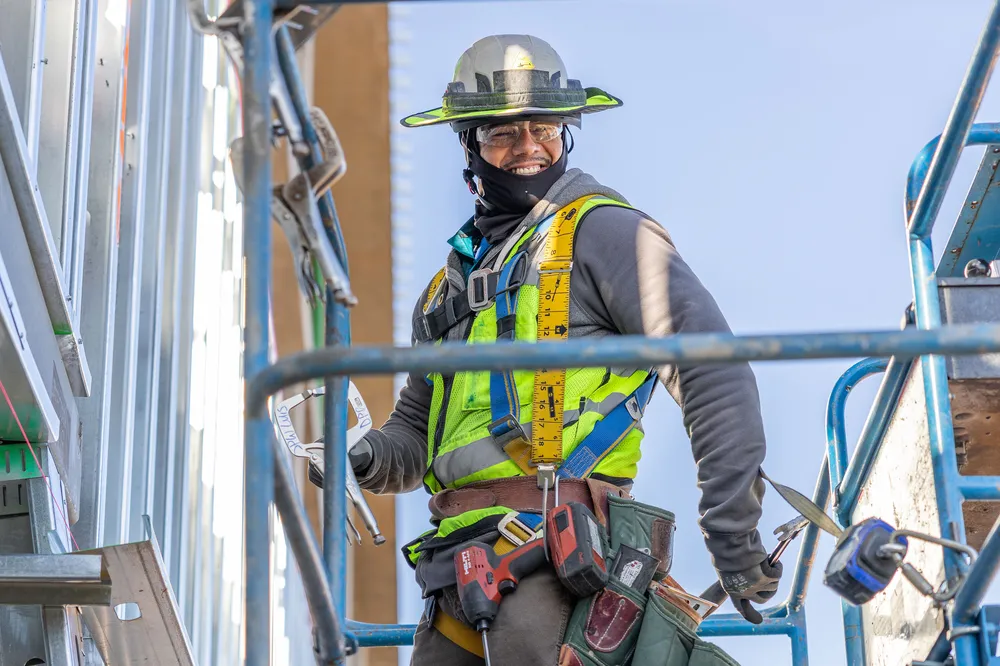 smiling craft worker in full ppe