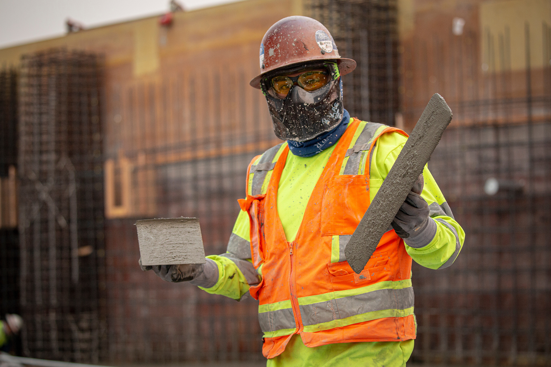 A DPR employee holding concrete tools.