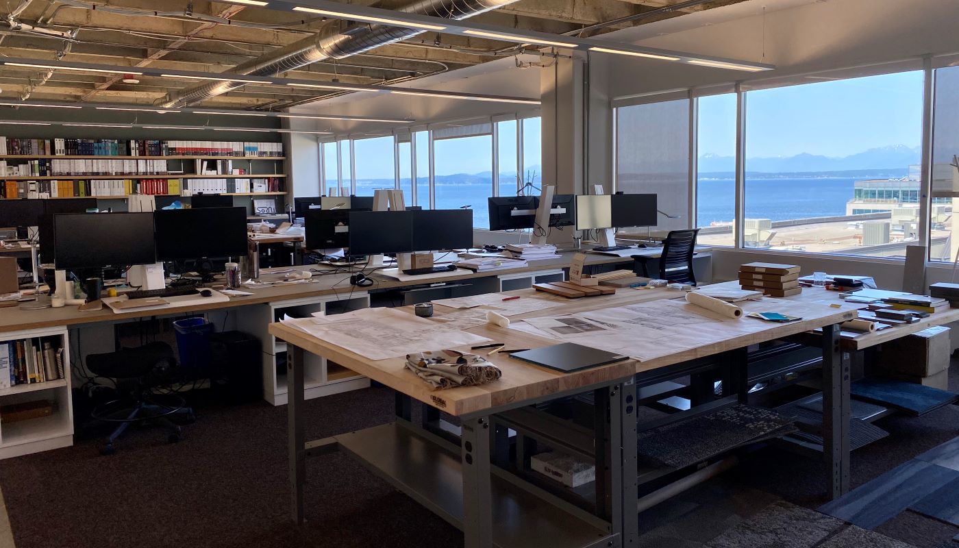 Interior workspace and desks at the WRNS Studio Office with views of Elliott Bay